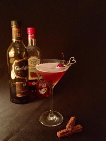 Scotch Flirting, garnished with a black cherry